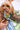 Man holding dog in matching Sesame Street™ print bandana