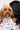 Dog in Sesame Street™ comic print bandana held by woman