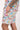 Close-up of hand in pocket of Sesame Street™ comic print shorts