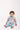 Baby sitting in Sesame Street™ comic print onesie