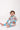 Baby sitting in Sesame Street™ comic print onesie with blue cuffs