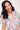 Close-up of woman smiling in Sesame Street™ comic print PJ top