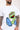 Close-up of Oscar the Grouch graphic on white tee