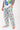 Close-up of hand in pocket of Sesame Street™ print pants