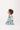 Side view of baby sitting in Sesame Street™ print onesie
