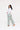 Side view of woman in Sesame Street™ print straight-leg pants