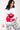 Woman smiling in Elmo graphic top with hand in pocket